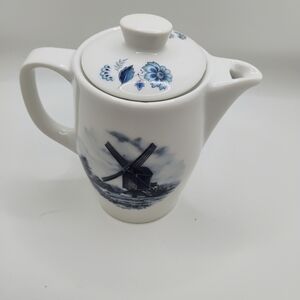 Elegant White and Blue Teapot with Windmill Design